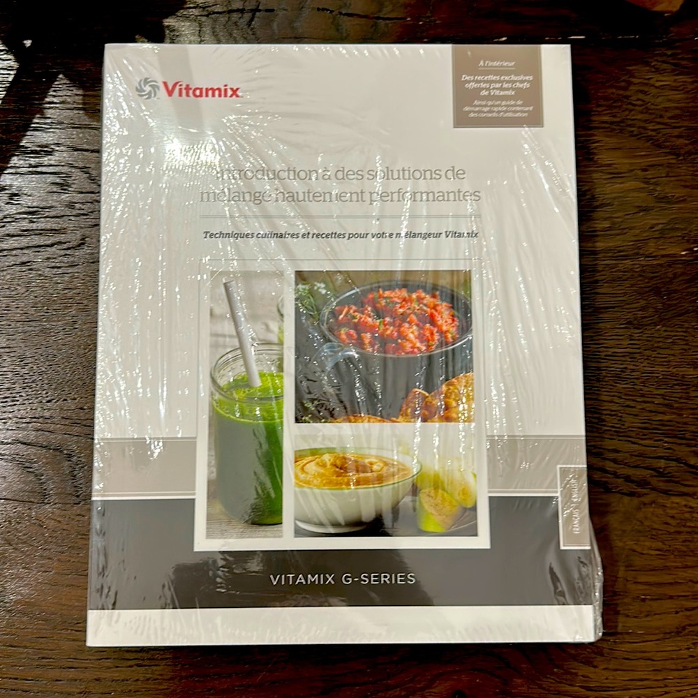 Vitamix book, smoothie cup/shaker cup, blender container, and tamper tool